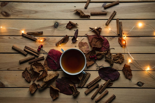 cinnamon tea surrounded by fairy lights and cinnamon sticks
