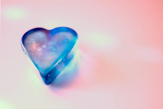 blue heart against pink background representing best teas for heartburn