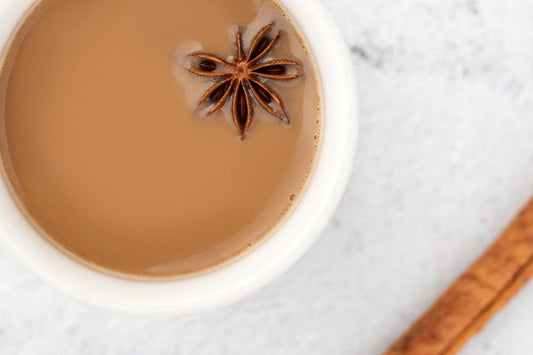 milky chai tea and cinnamon stick